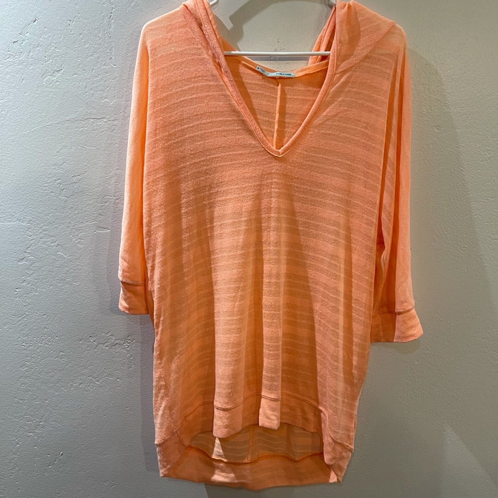Bright Orange with a hood. Size Large.